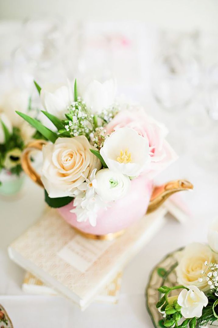 Pink teapot with flowers sitting inside by Dominique Bader Photography 