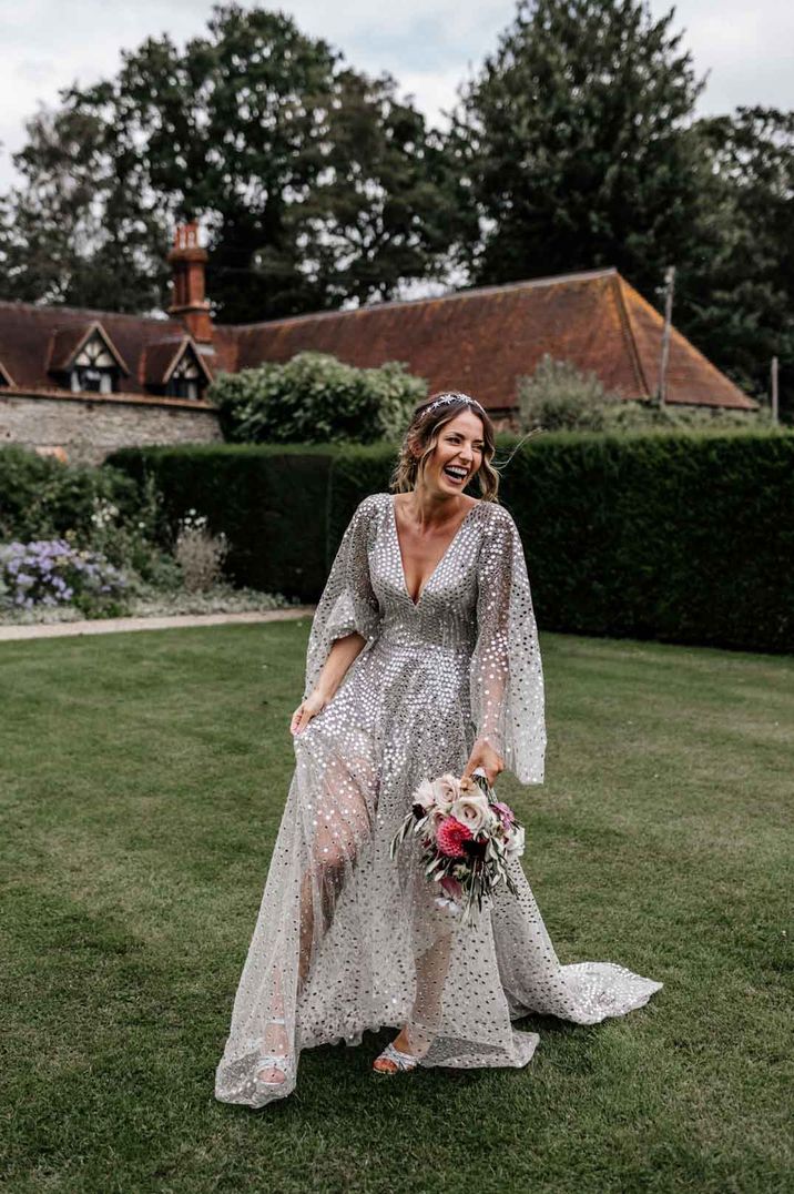 Bride in v-neck long sleeve silver sequin wedding dress and ethereal bridal headband 