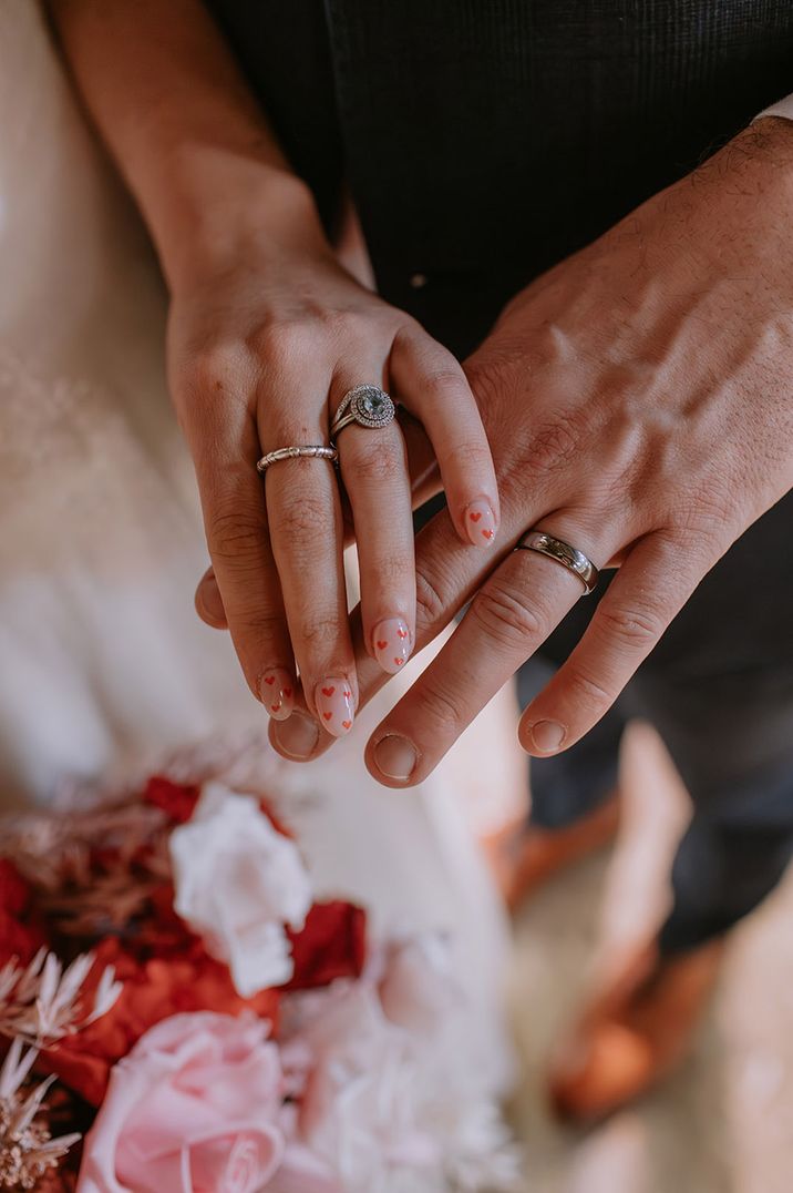 Bride with red heart nail art for her wedding nails 