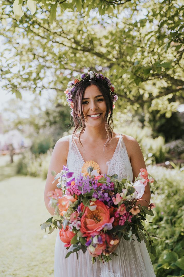 Wedding flower bouquet held by bride inspired by birth flowers 