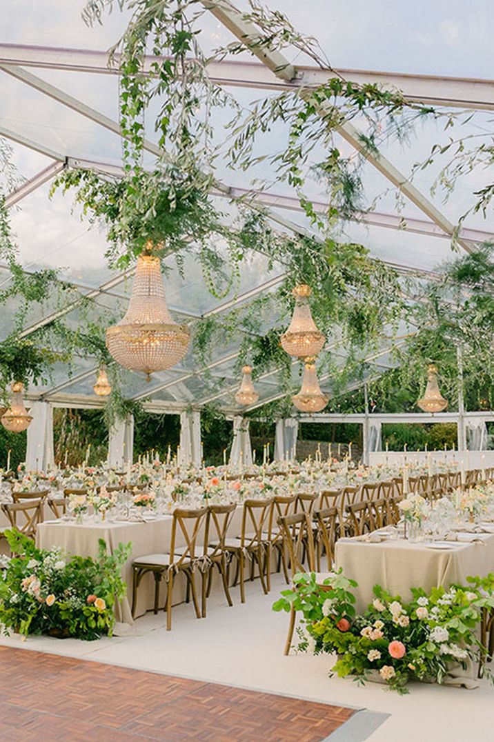 The orangery and glasshouse with chandeliers and colourful flowers for wedding at Hamswell House 