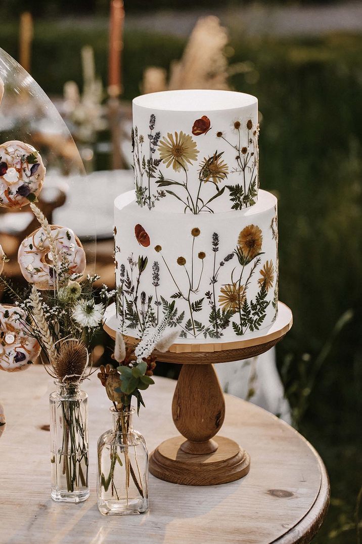 Pressed flower two tier wedding cake for botanical wedding 