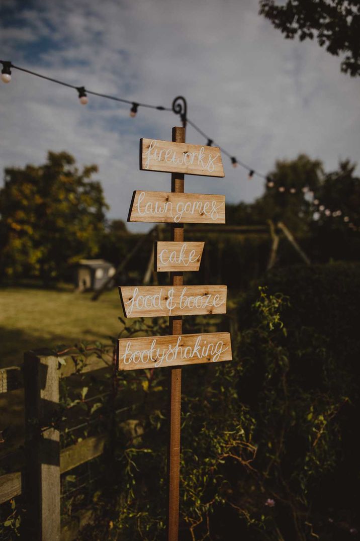 DIY wooden wedding sign at outdoor wedding