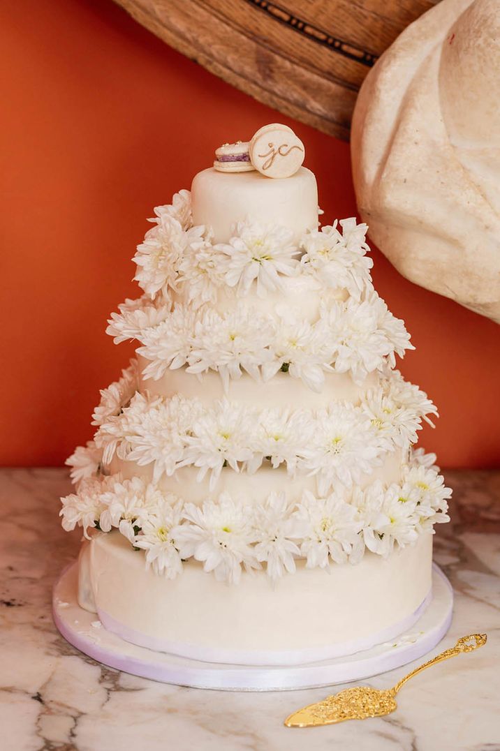 Small five layered wedding cake with personalised macaron cake topper with iced flowers for wedding under 40k 