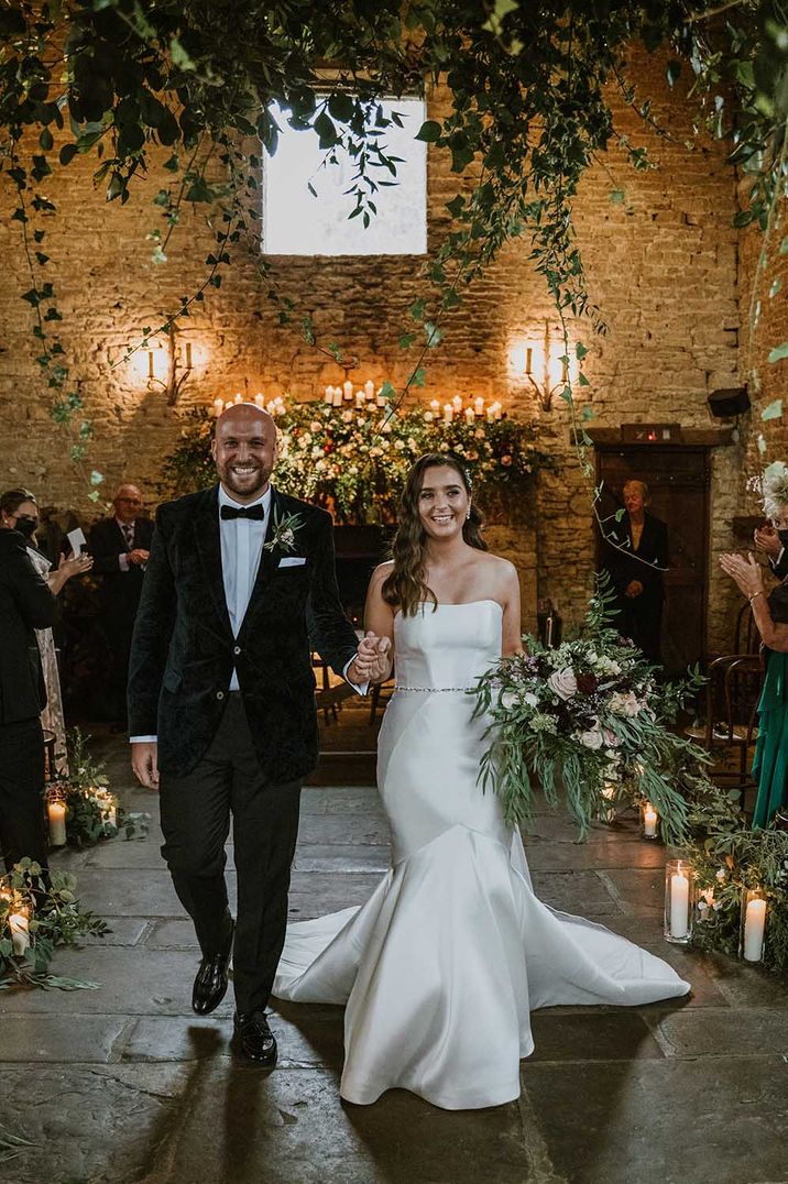 Cripps Barn civil wedding with bride in a fishtail wedding dress and natural wedding flowers 