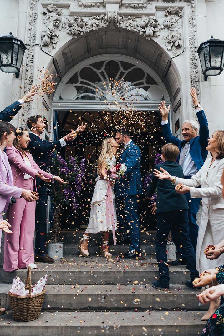 Bride and groom have confetti exit from town hall wedding 