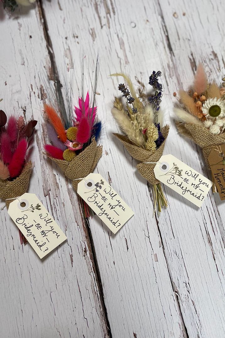 Mini preserved flower bouquets with personalised notes as a bridesmaid gift and memento 