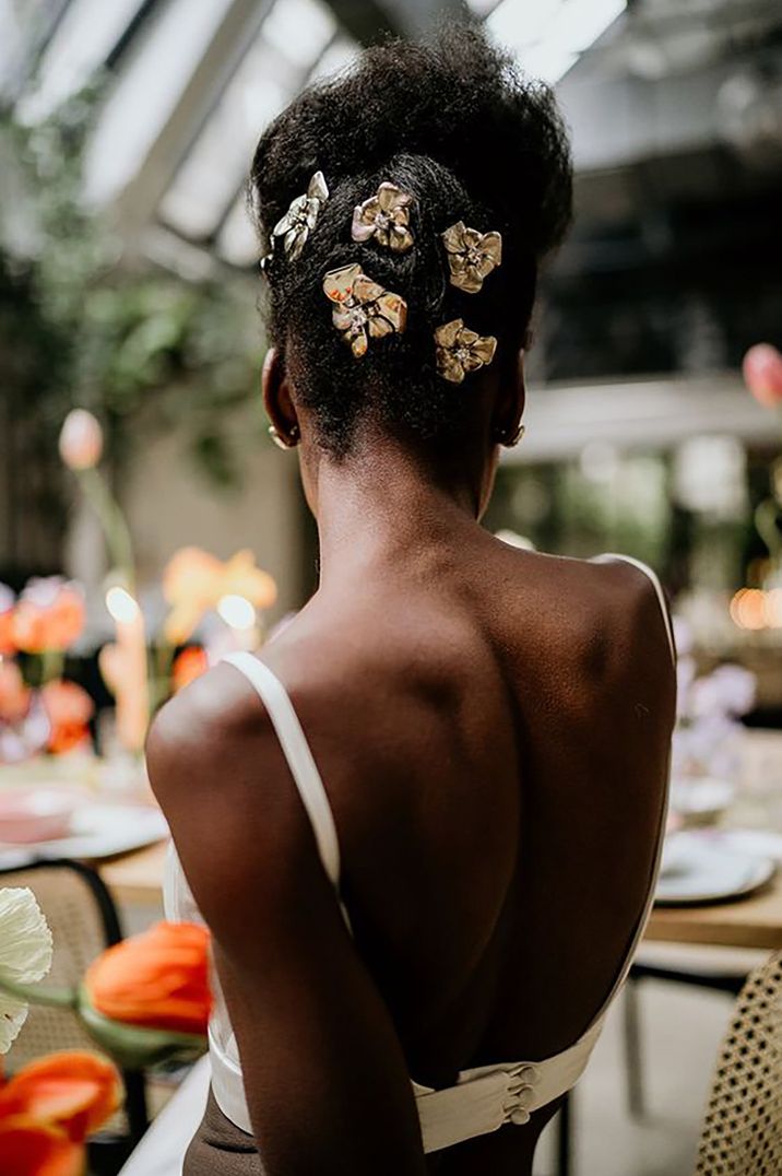 bride with afro hair updo and wedding hair accessories