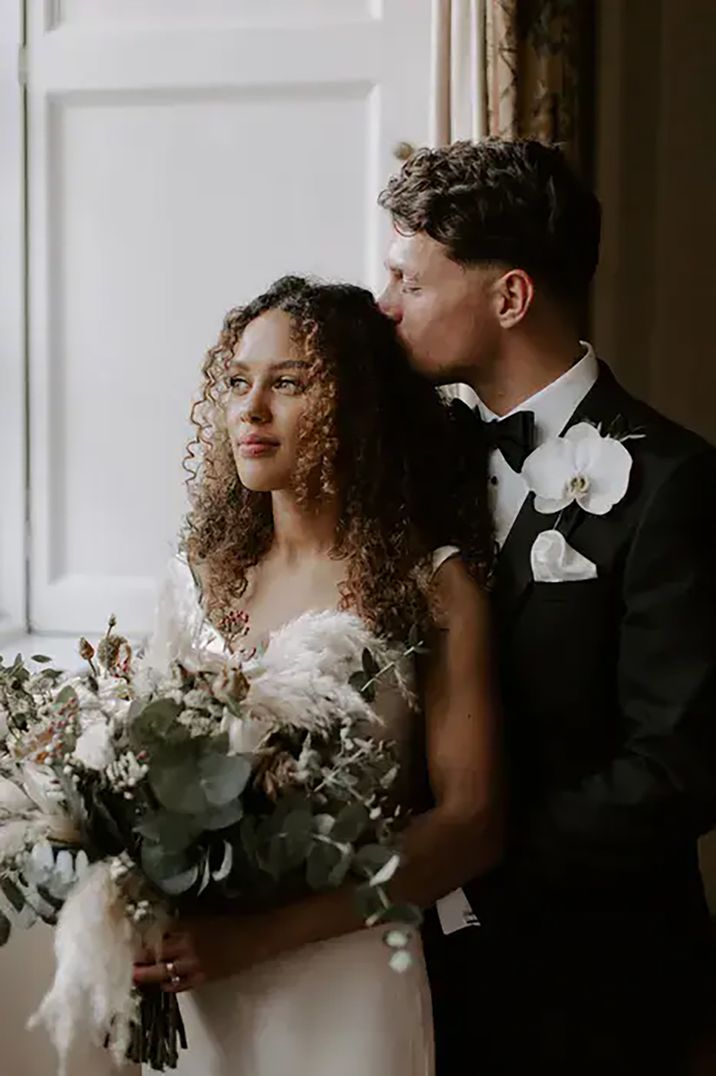 bride with half up, half down afro textured curly hair on wedding day