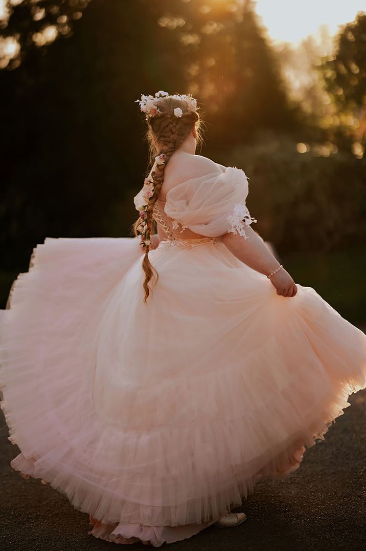 Bride wears light pink off the shoulder princess wedding dress