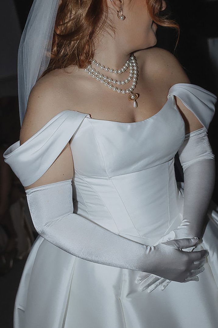 bride wearing a pearl layered wedding necklace