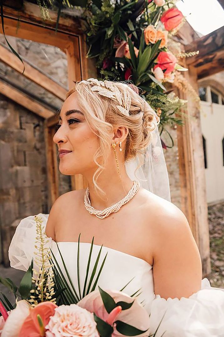 bride wearing a statement twisted pearl wedding necklace