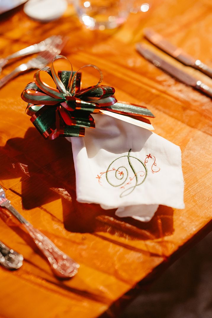 green-and-red-ribbon-wedding-place-setting-with-embroidered-napkin