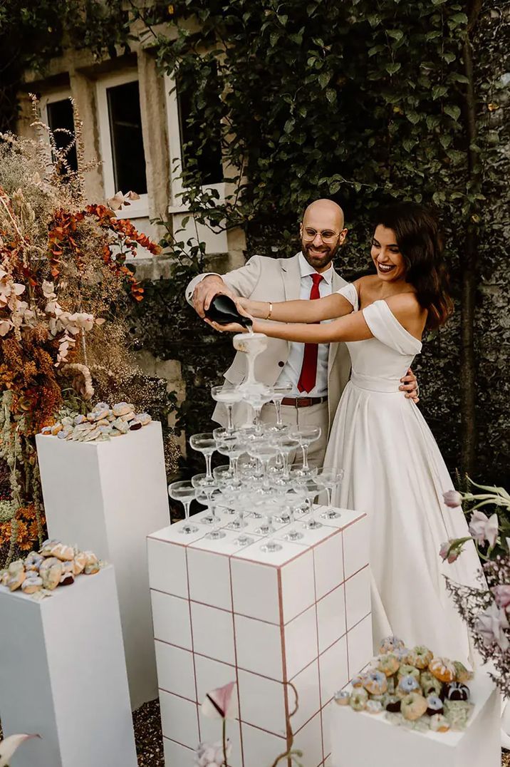 champagne-tower-with-happy-newlyweds