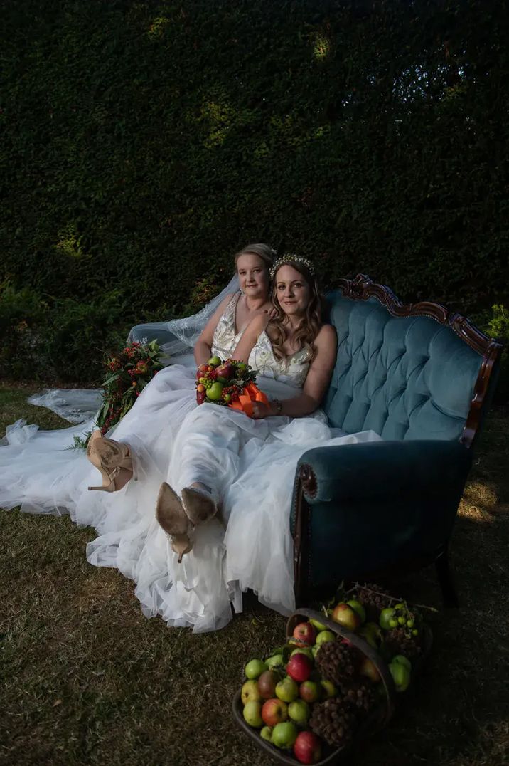 chapel-house-estate-two-brides-on-sofa