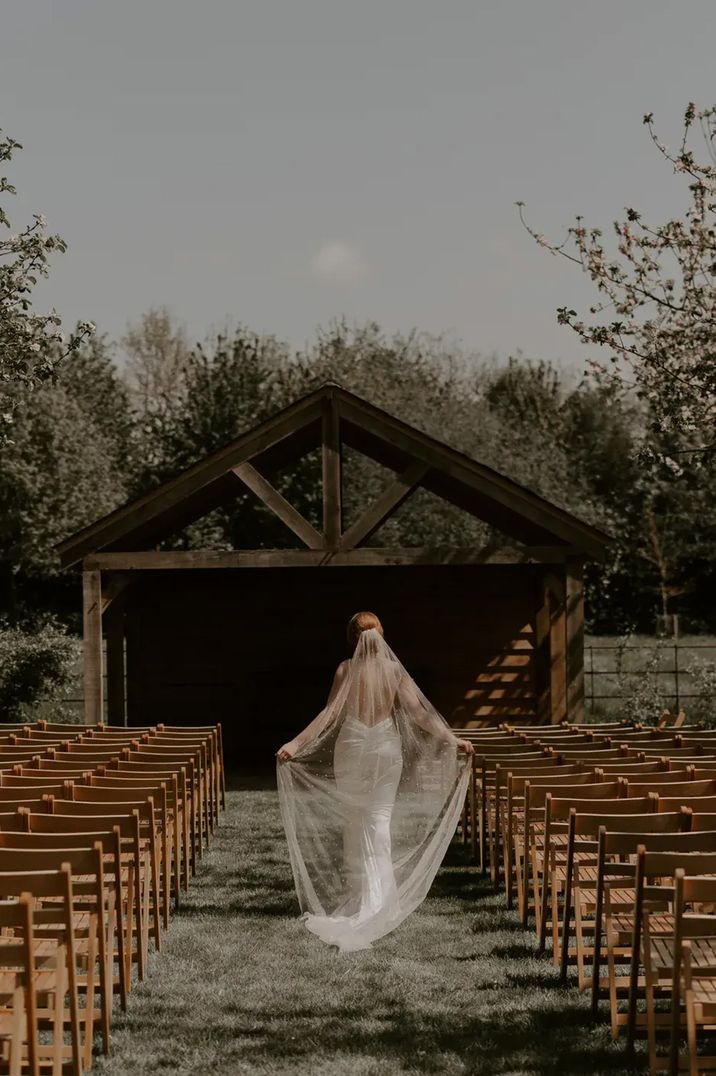 chapel-house-estate-with-bride-walking-at-outdoor-ceremony