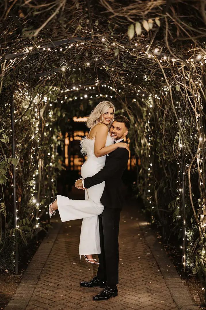 wedding-feather-jumpsuit-with-fairy-lights