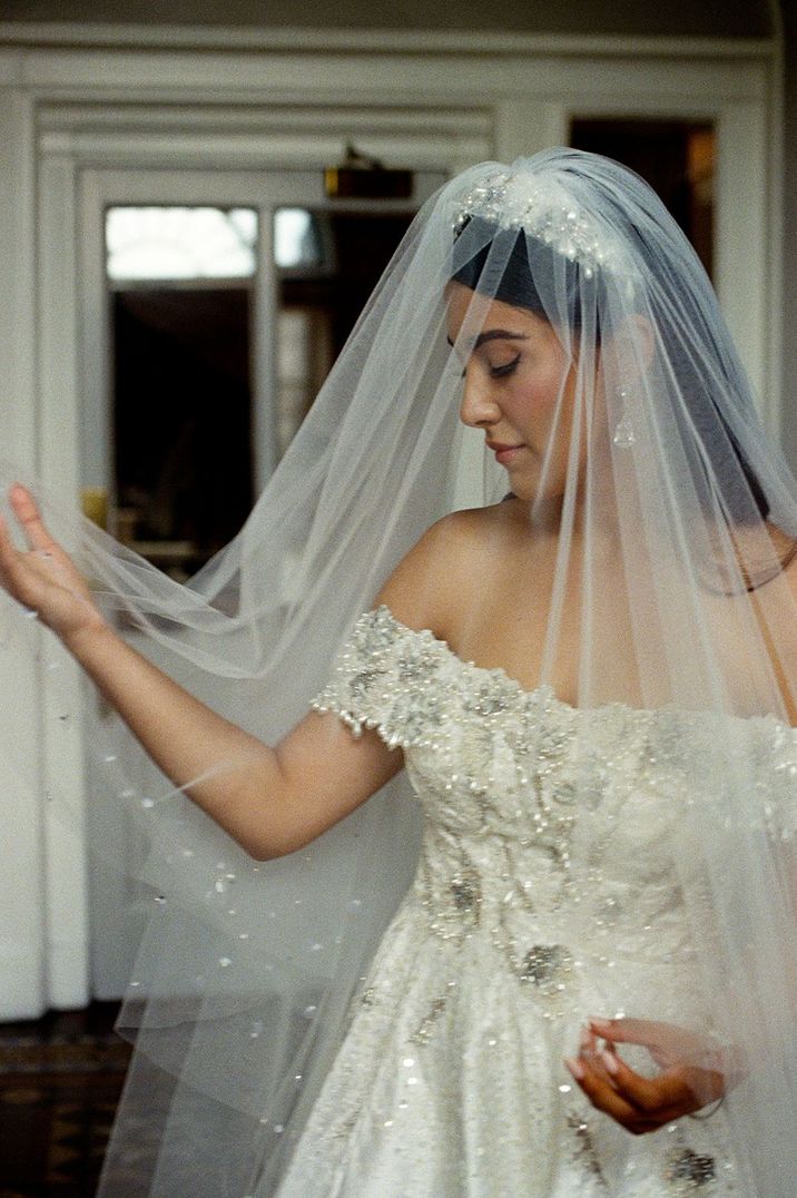 bride-in-off-the-shoulder-embellished-wedding-dress-with-veil