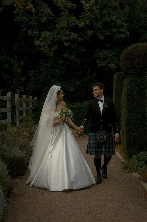 bride-in-princess-wedding-dress-with-groom-in-black-tuxedo