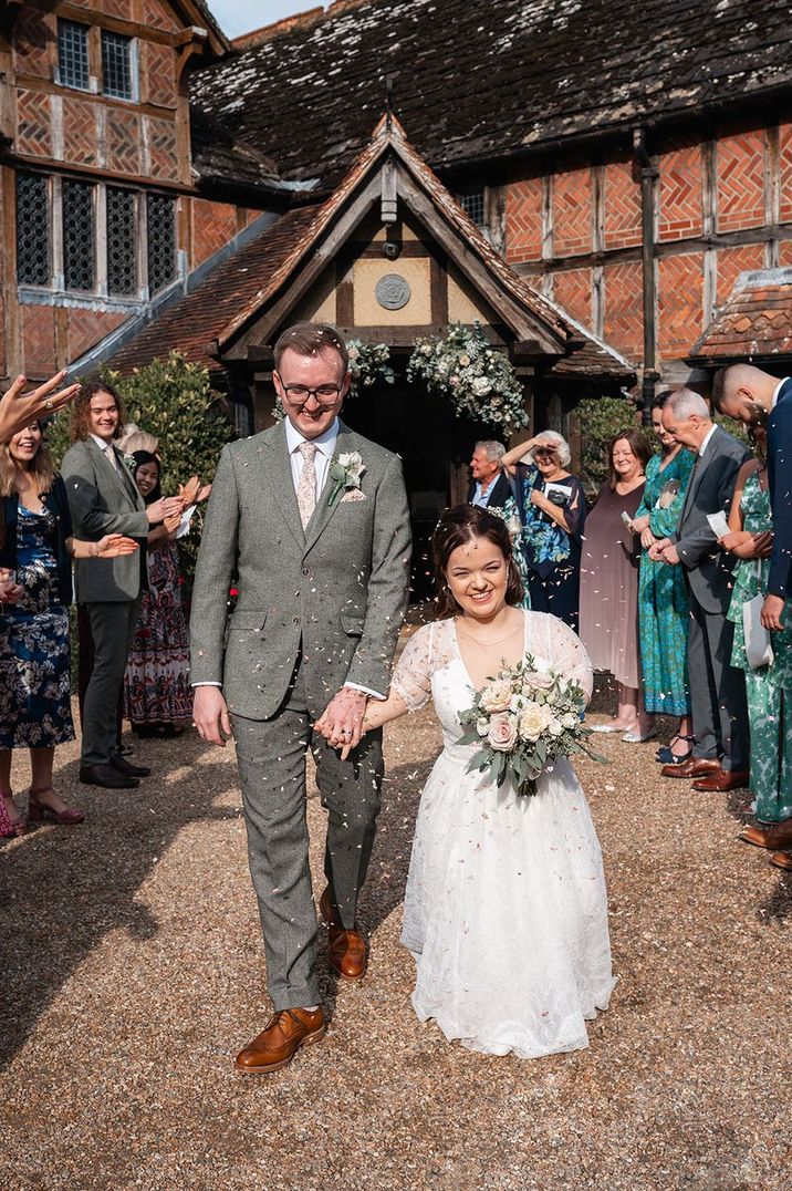 bride-with-dwarfism-walking-with-groom-at-confetti-exit