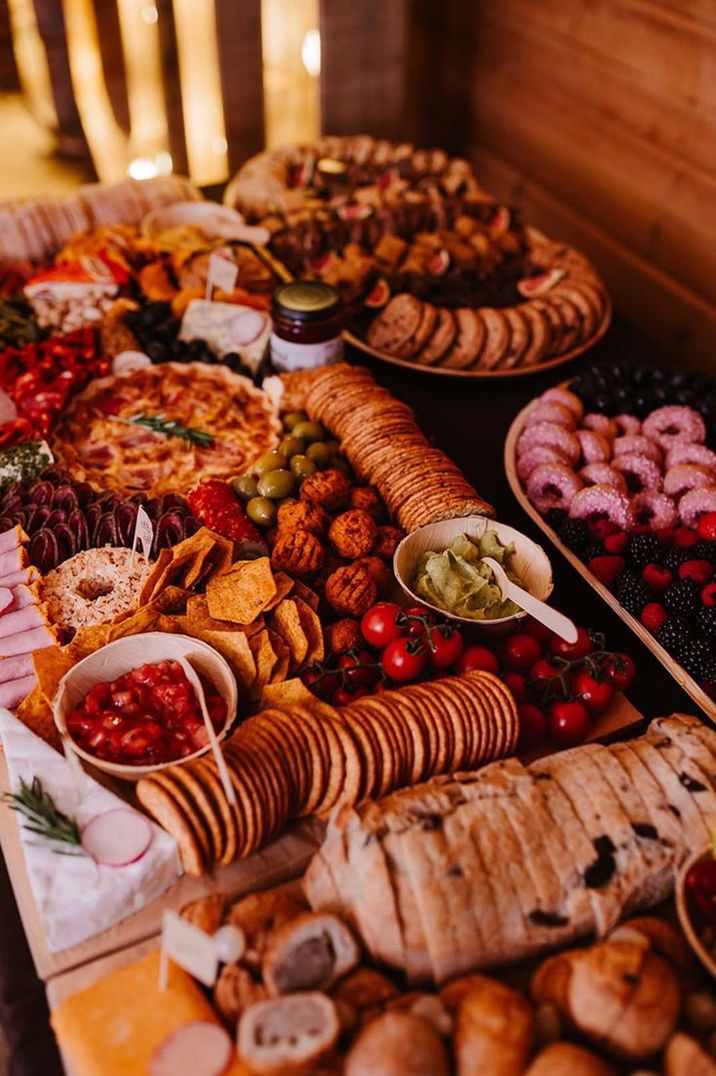 grazing-table-full-of-food-and-snacks-for-wedding-day