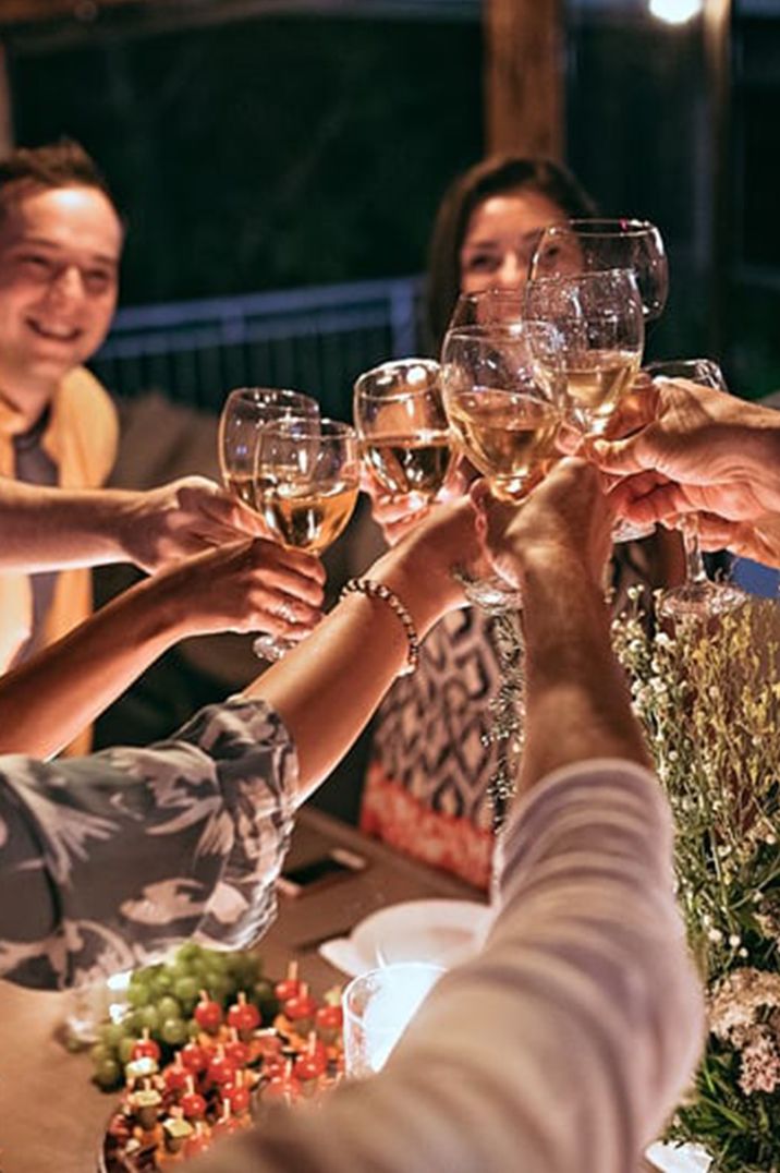 friends-toast-together-at-dinner-party