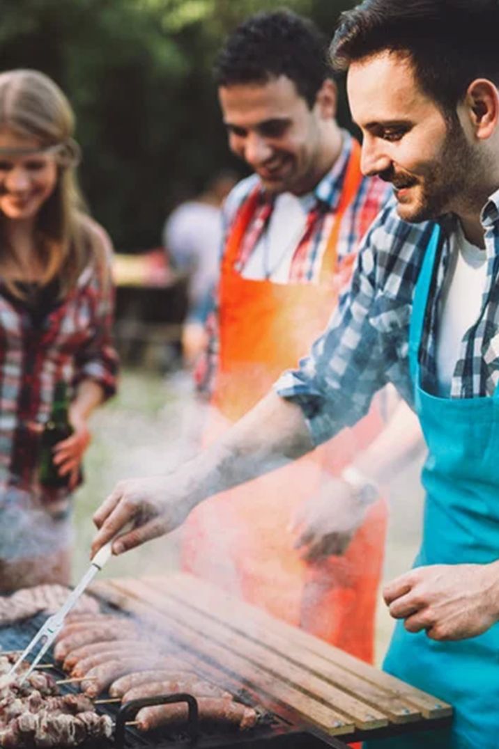 man-cooking-on-bbq-grill-for-party