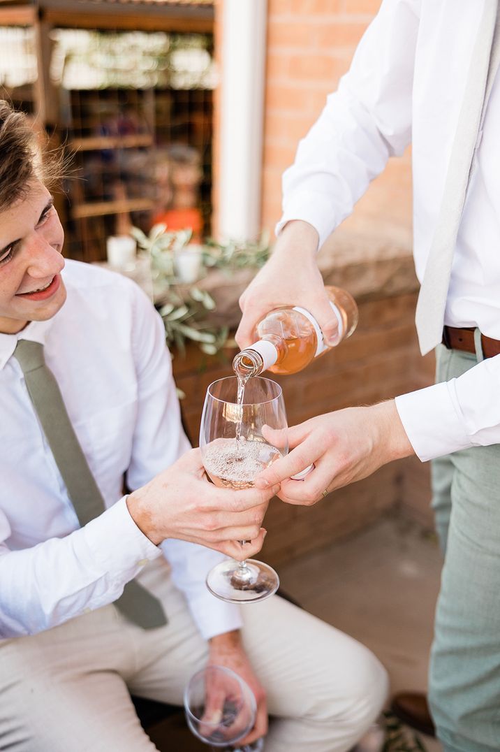 men-drinking-wine-at-engagement-party