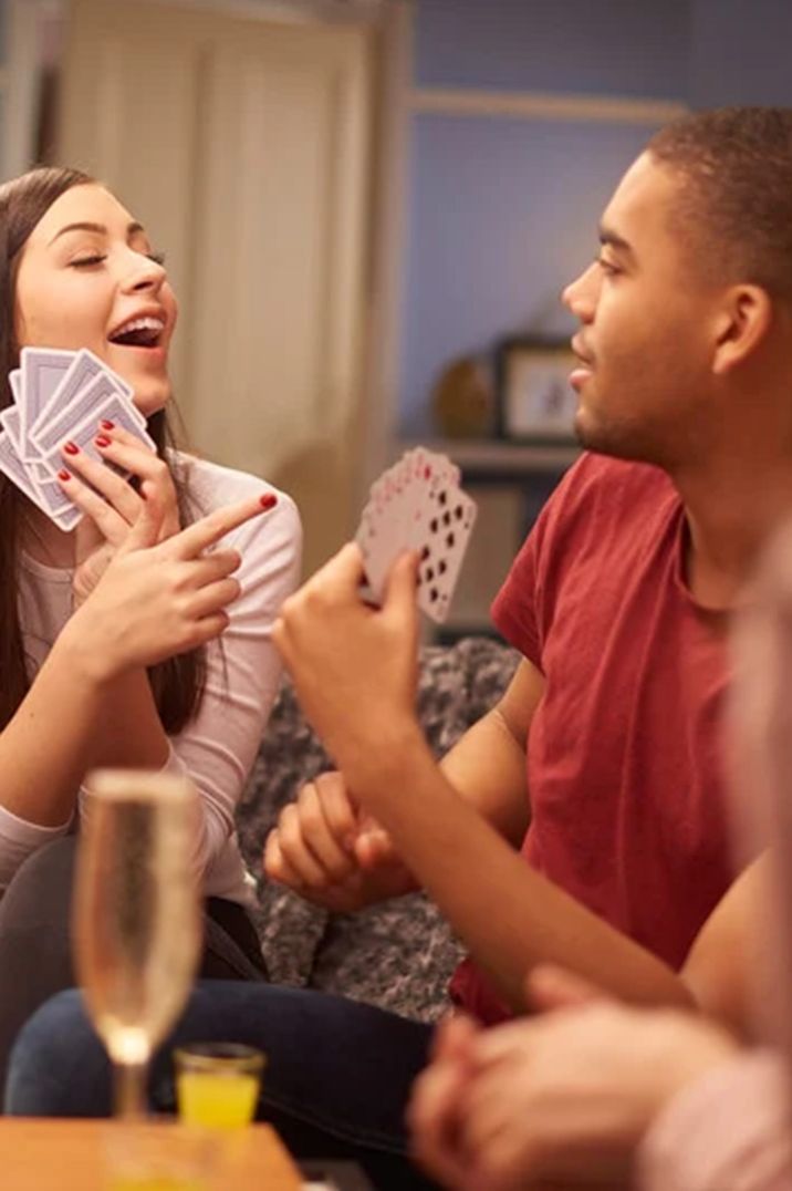 people-playing-card-games-at-game-night