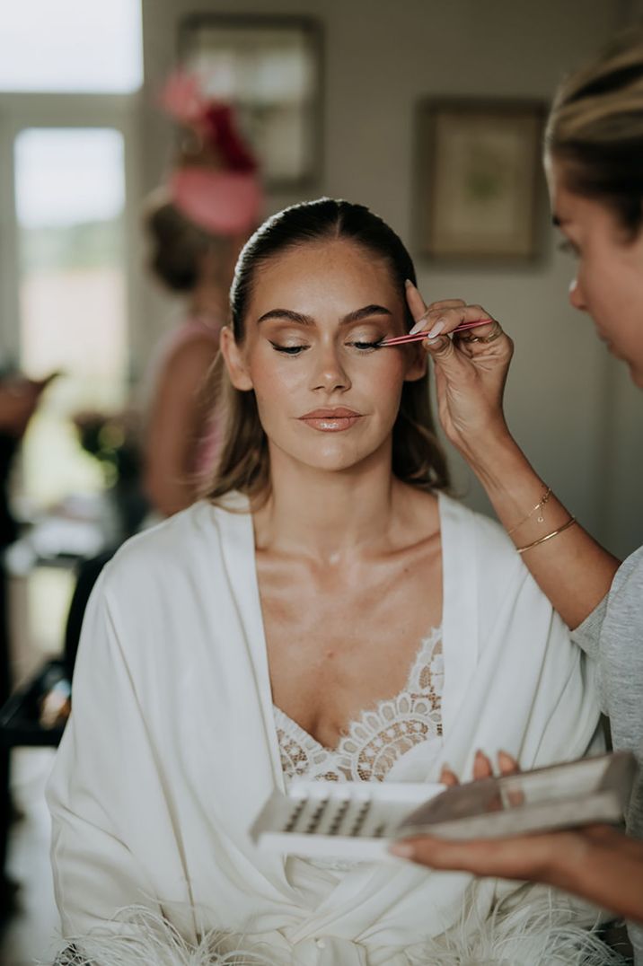 bride-gets-fake-eyelashes-put-on-pre-wedding-beauty-treatments