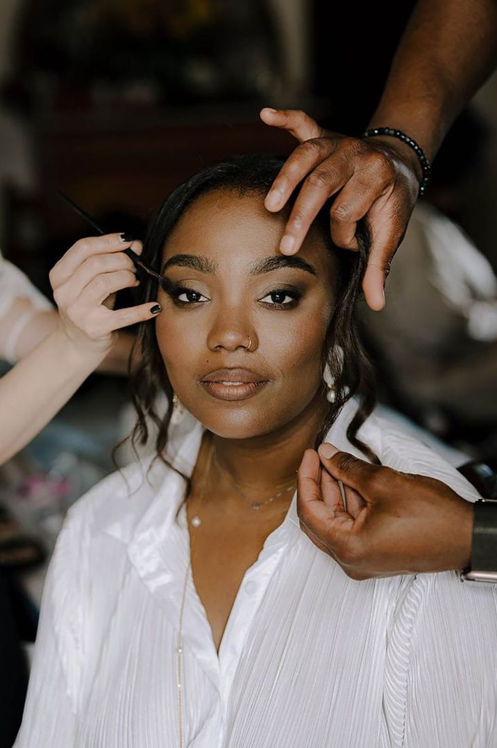 bride-gets-wedding-makeup-done-in-white-pyjamas