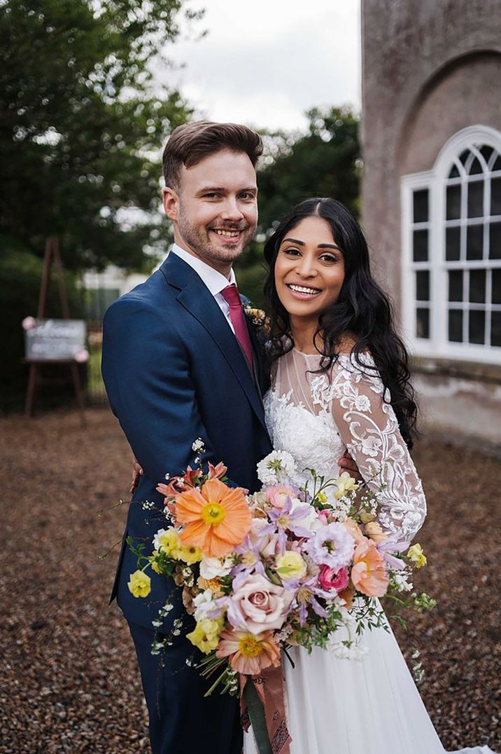 cute-couple-smiling-white-teeth-at-country-house-wedding