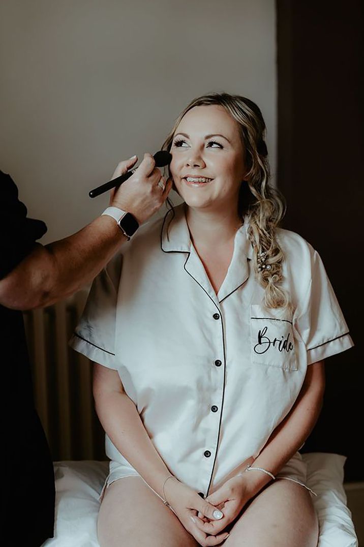 bride-wearing-bridal-pjs-getting-makeup-done-Patrick-Partridge-Photography