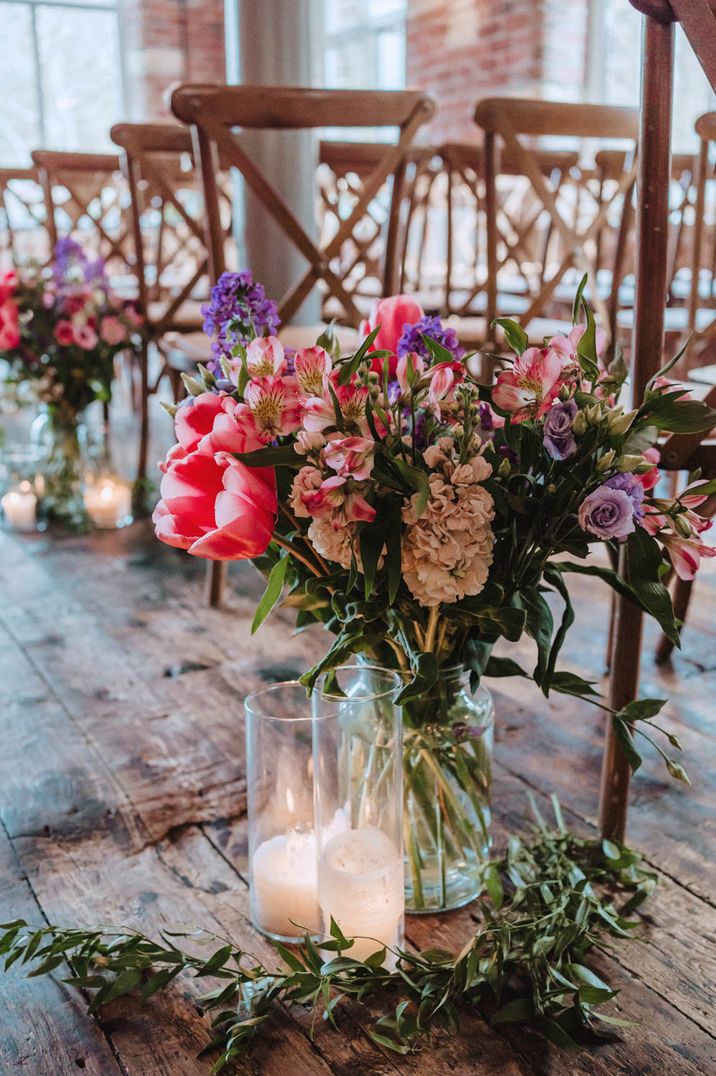 pink-and-purple-wedding-aisle-flowers