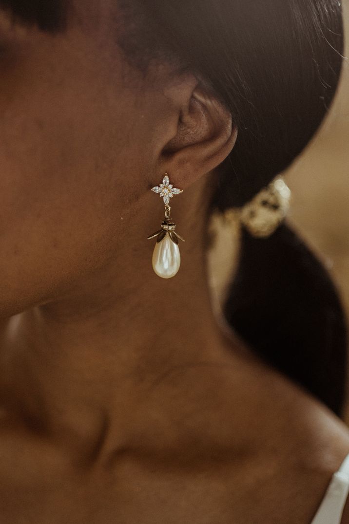 bride-wearing-pearl-drop-earrings