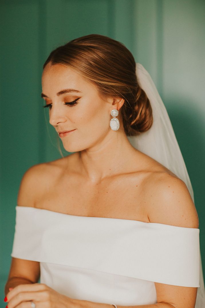 bride-wearing-statement-drop-earrings