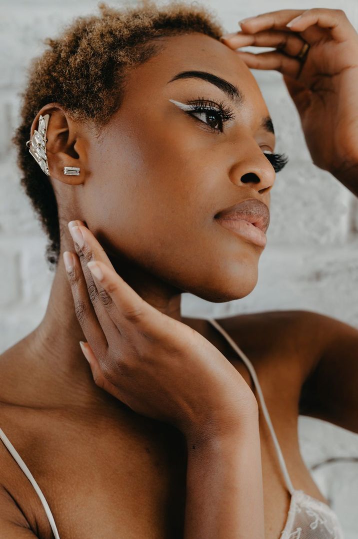 bride-wearing-silver-metallic-wedding-ear-cuff