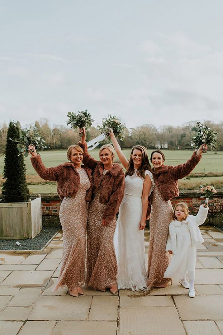 gold sequin winter bridesmaid dresses with brown faux fur jackets