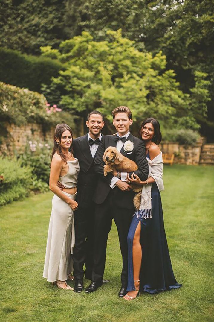 grooms and wedding guests wearing black tie dress code attire at dog-friendly, black-tie wedding