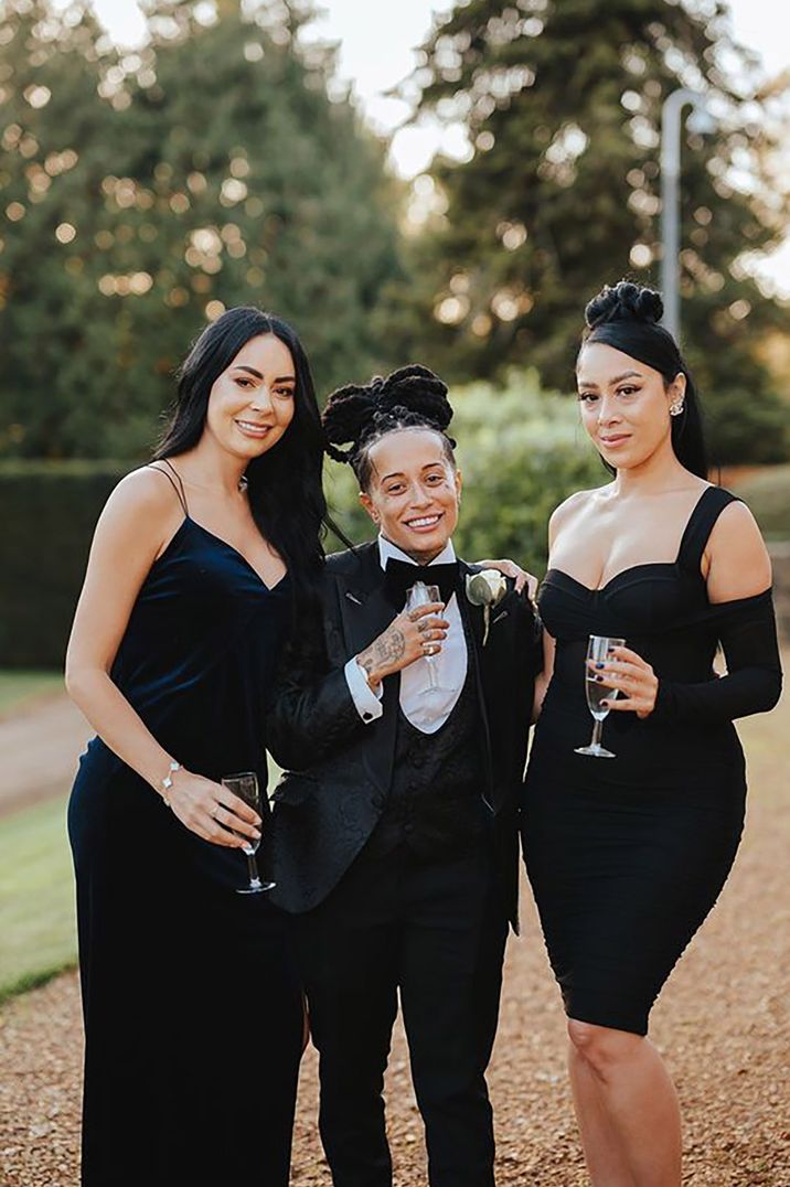 bride and two guests/ bridesmaids wearing black tie dress code for LGBTQIA+ wedding 