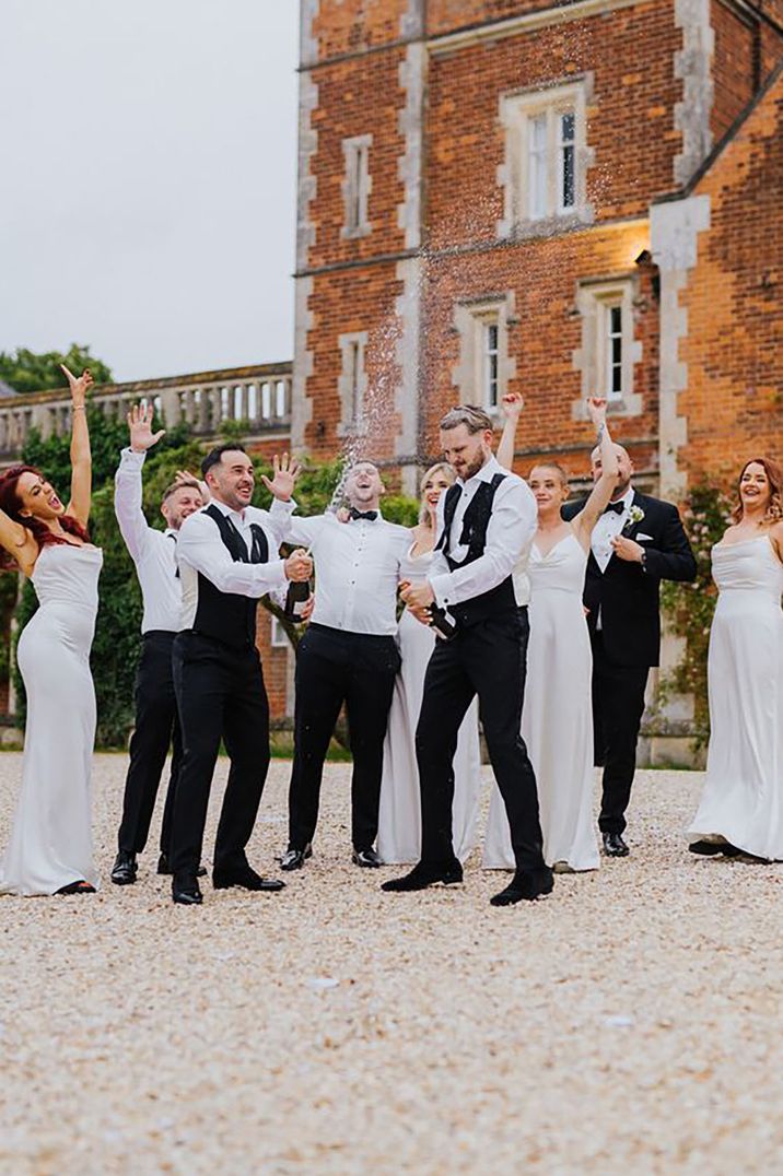 wedding guests, wedding party and grooms wearing black tie dress code attire