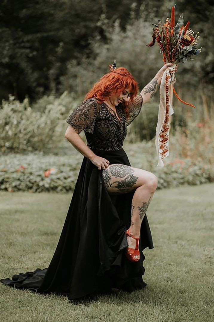 bride wearing short sleeve, black and embellished wedding dress