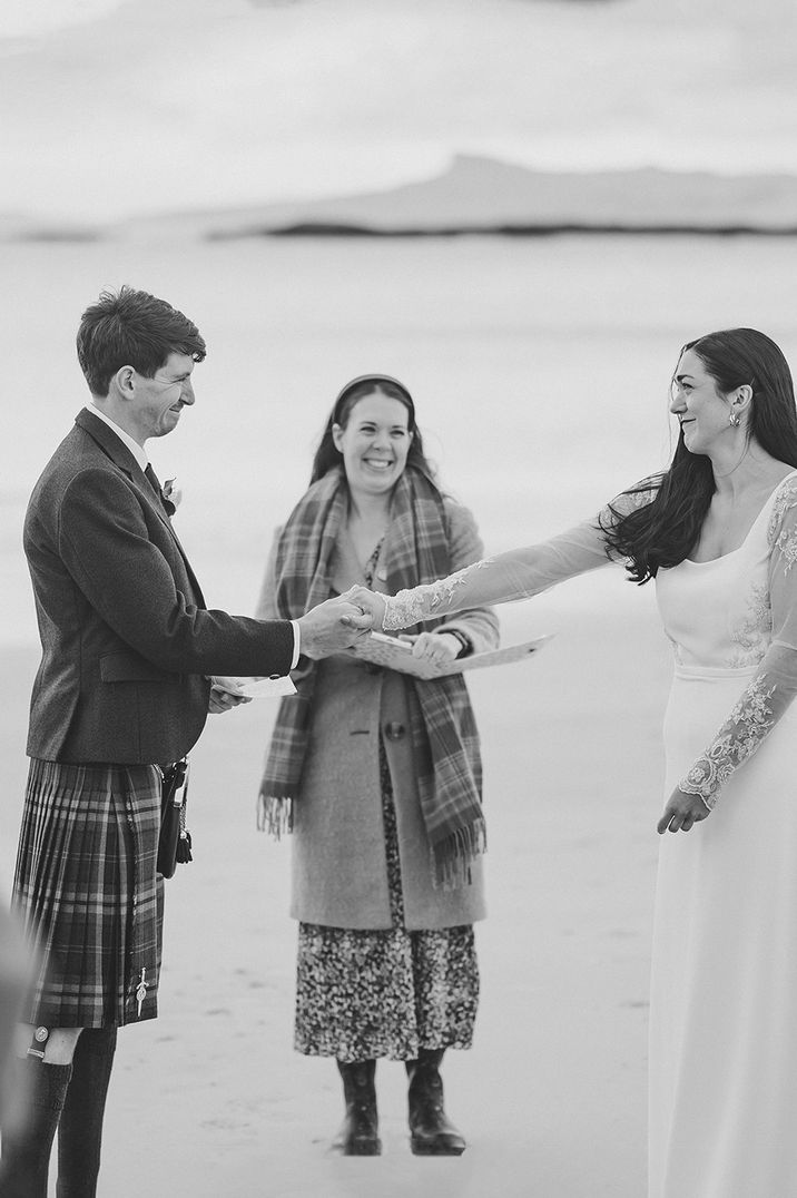 bride-and-groom-exchange-wedding-vows-on-beach-best-wedding-dates-to-get-married-2025