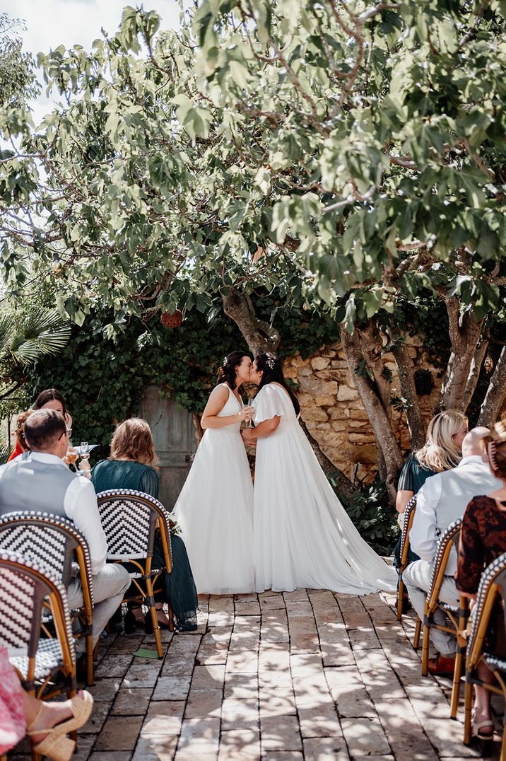 brides-share-first-kiss-as-married-couple