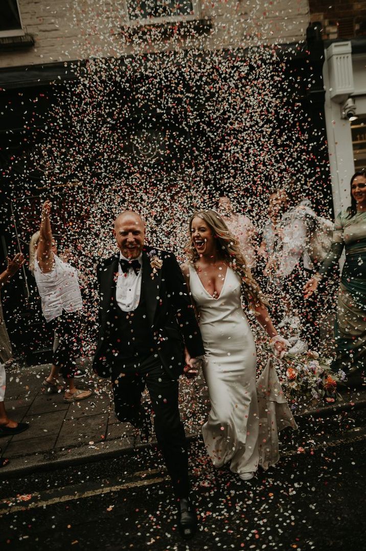 Epic Confetti Exit at London Elopement with Satin Wedding Dress