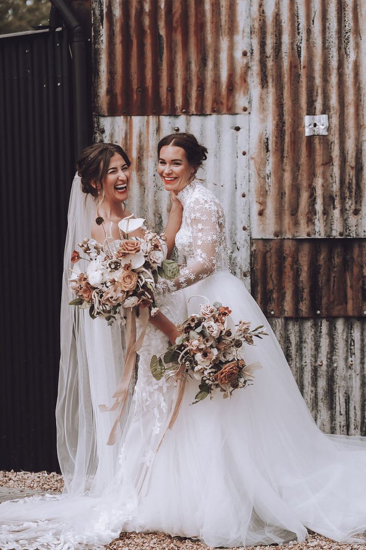 Same Sex Wedding with Two Brides in Flower Lace Wedding Dresses with Neutral Wedding Bouquet