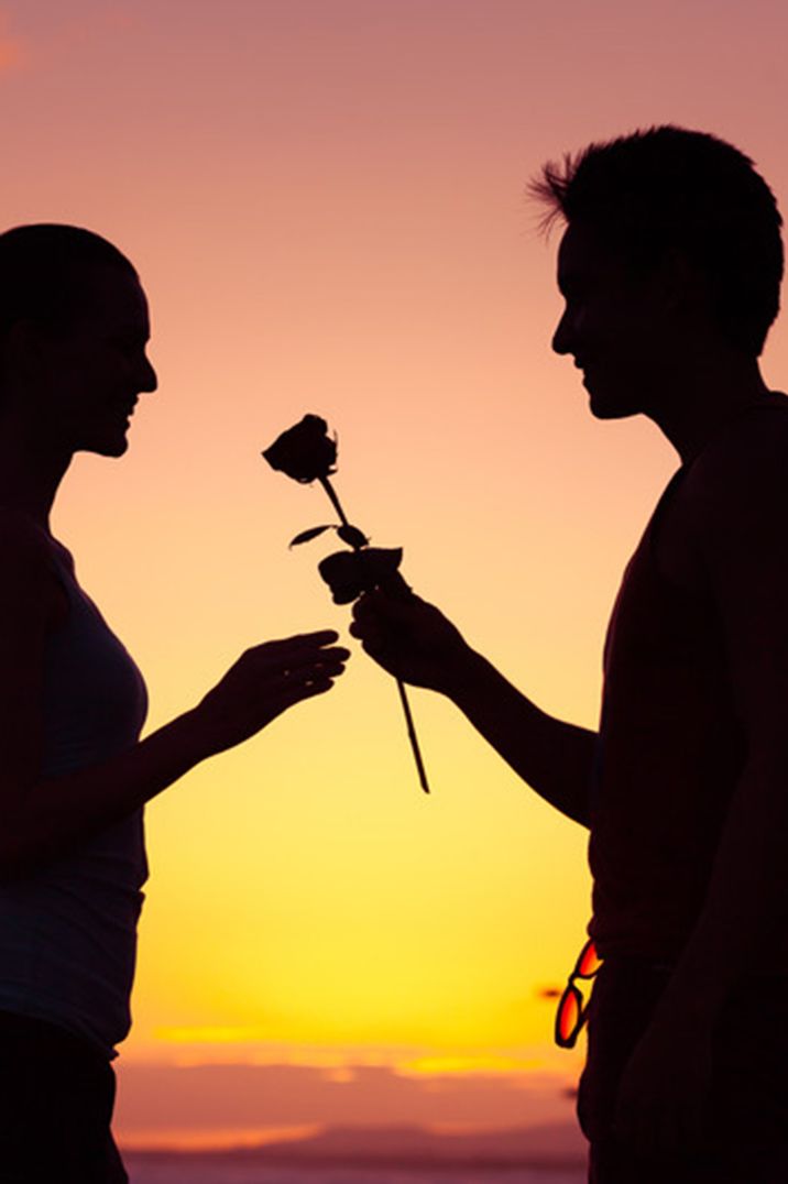 man-gives-woman-rose