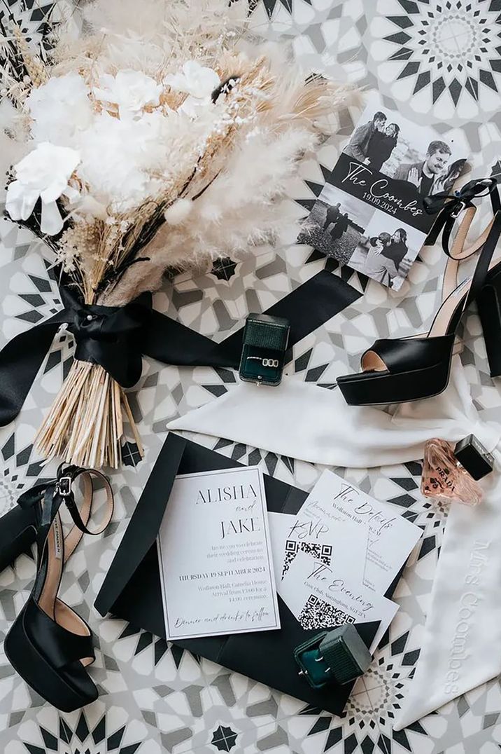 monochrome wedding theme accessories for bride, including heels and perfume