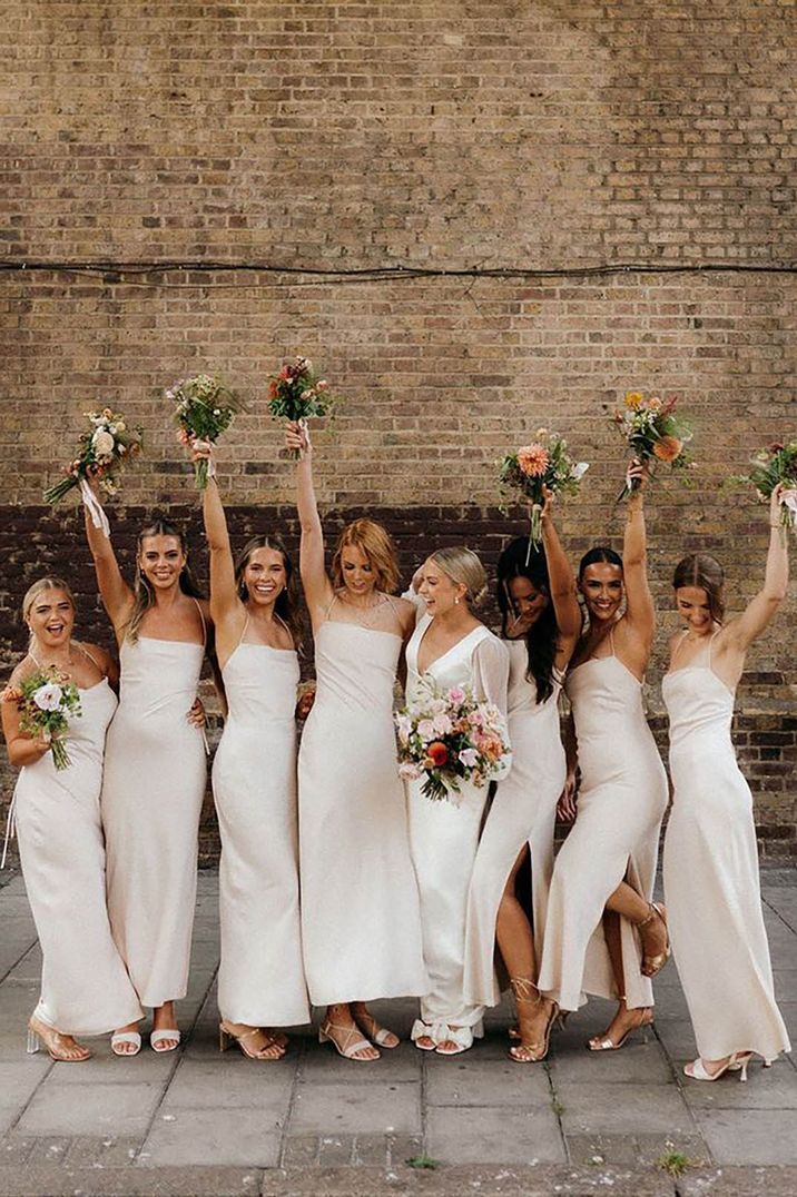 bridesmaids wearing neutral dresses