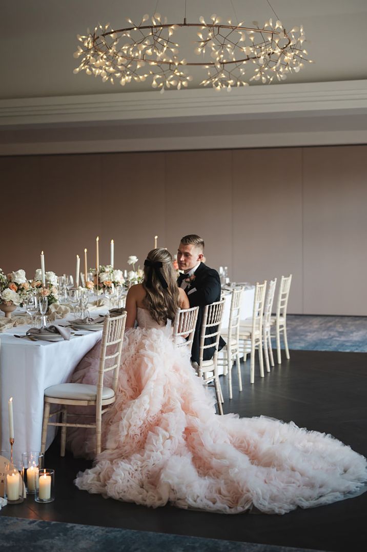 bride wearing statement peach tulle wedding dress